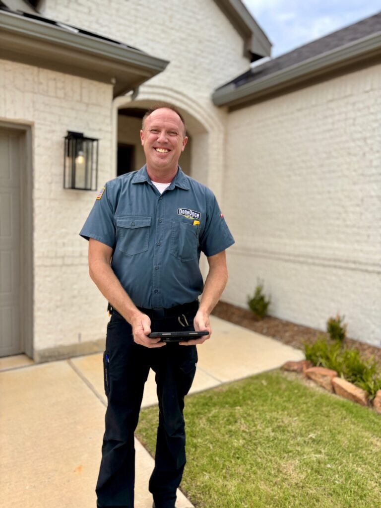 Scott standing in front of customer's home